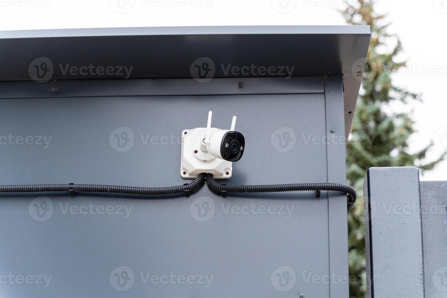 An electrical connector that is securely mounted on a gray enclosure and features associated wiring for enhanced functionality and performance photo