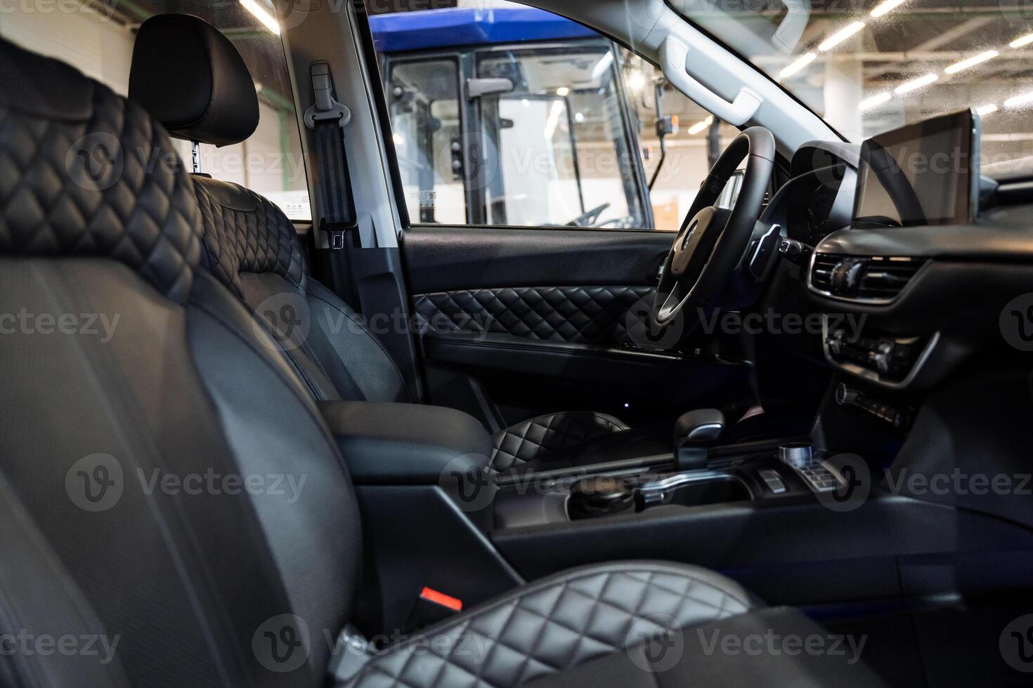 This image captures a detailed close up of the interior of a car parked in a garage, focusing on various design elements and components that contribute to its overall aesthetic appeal photo