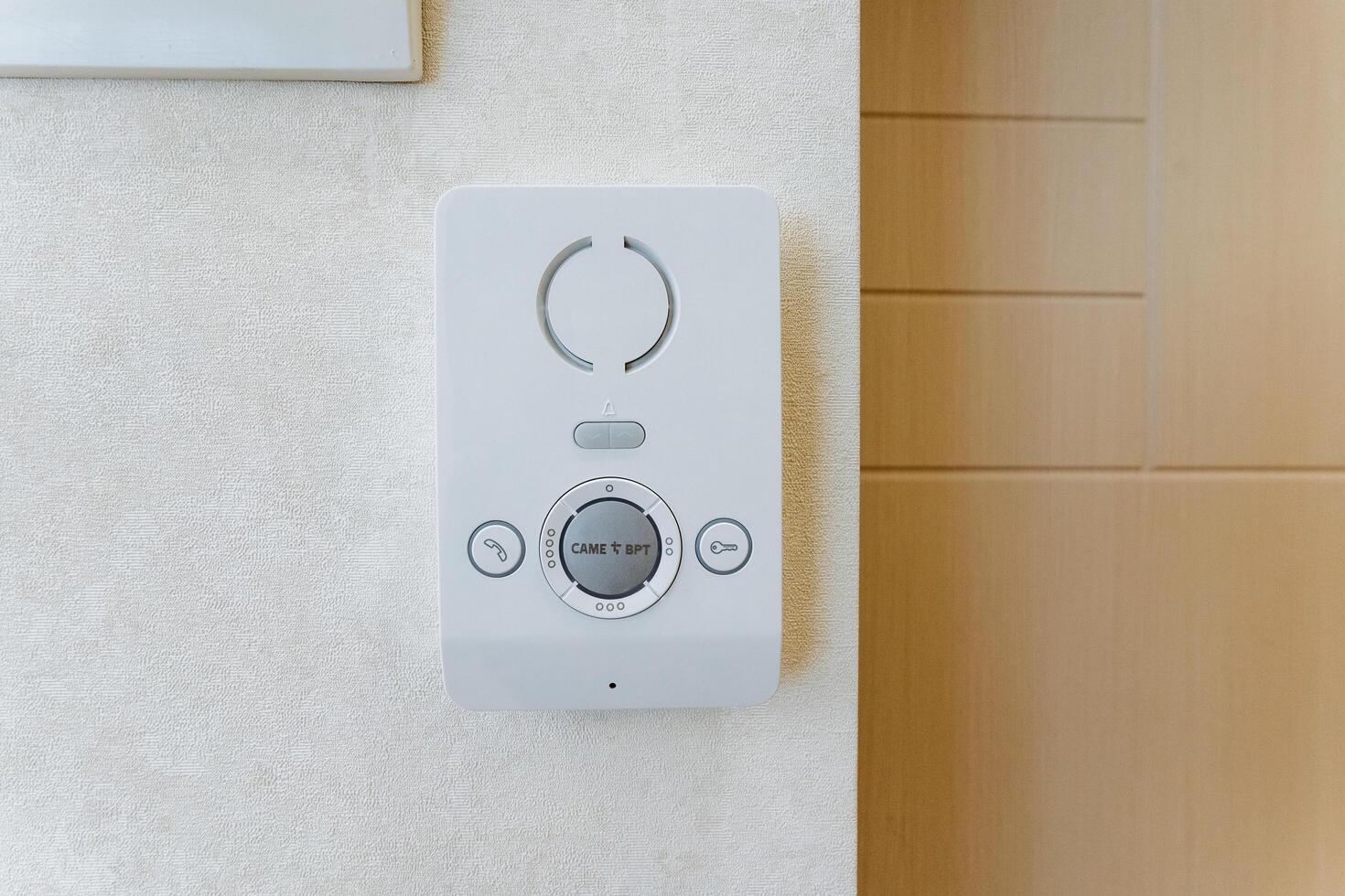 The digital climate control panel on the light wall interior offers precise adjustment for temperature and ensures a comfortable indoor environment with modern smart technology photo