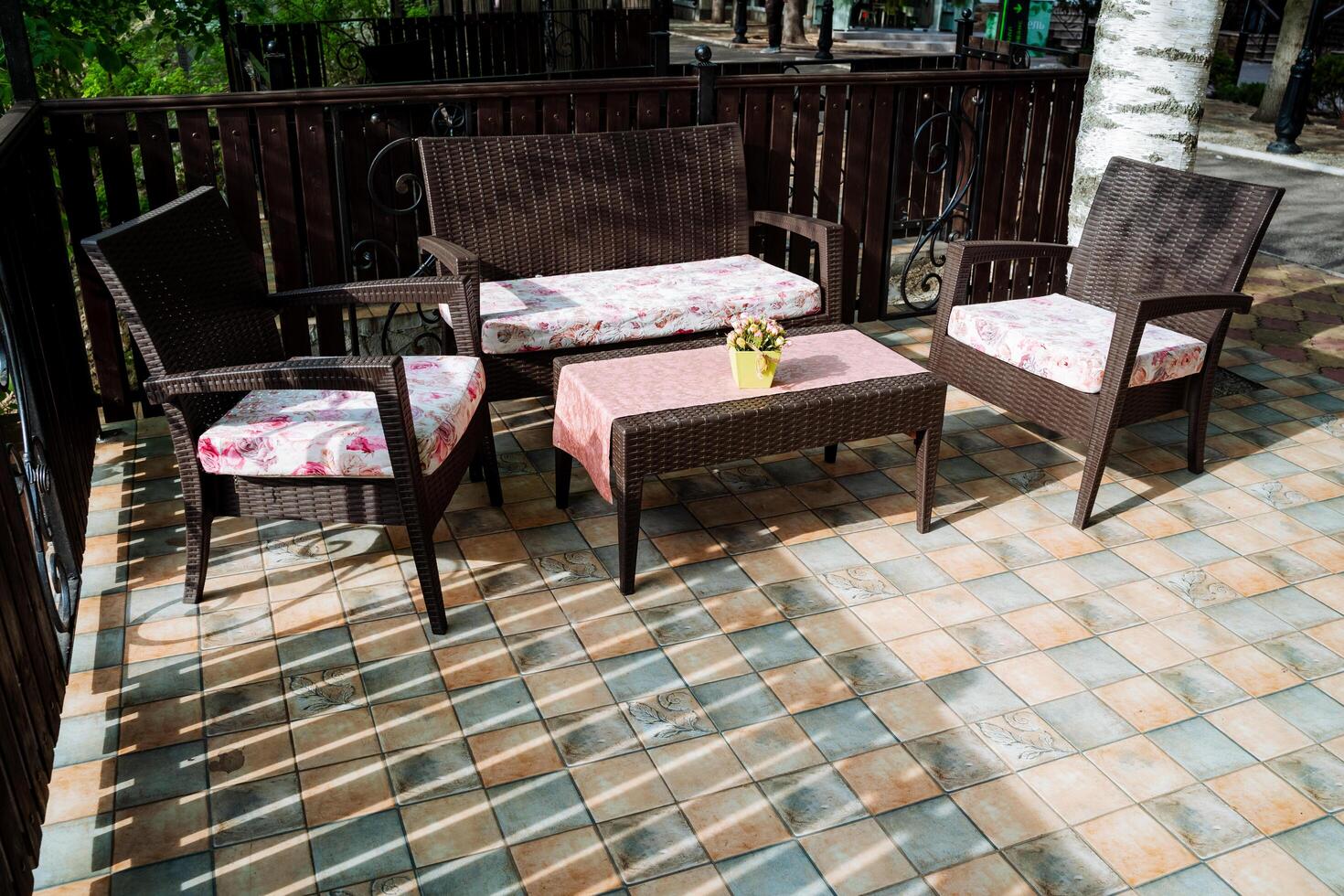 The patio is beautifully furnished with a couch, chairs, and a table, making a cozy outdoor space. Its a perfect spot to relax and appreciate the natural surroundings nearby photo
