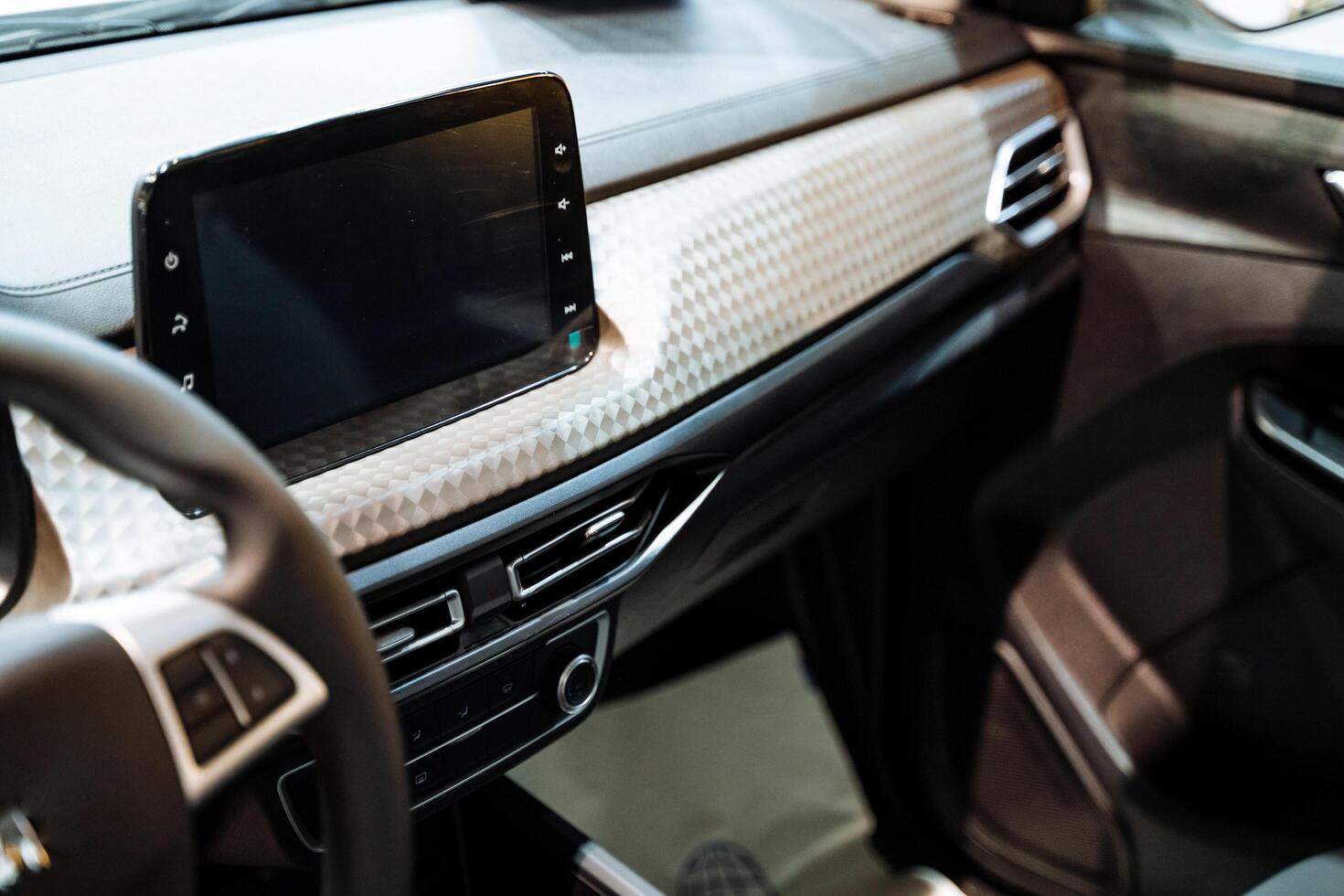 The interior of a car encompasses essential components such as the steering wheel and radio, which play a vital role in ensuring safe driving and providing entertainment throughout travel photo