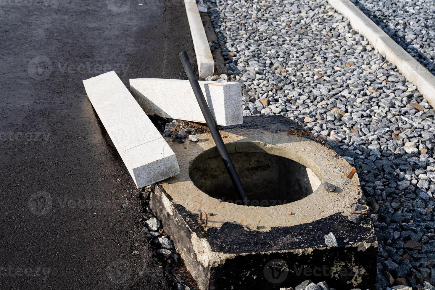 A sturdy and solid concrete block featuring a circular hole situated right in the center, which can serve various practical applications and uses in multiple fields and industries photo