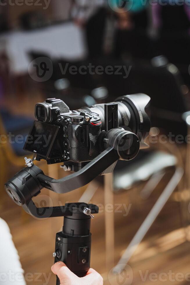 Person using camera accessory on gimbal for stable shots photo