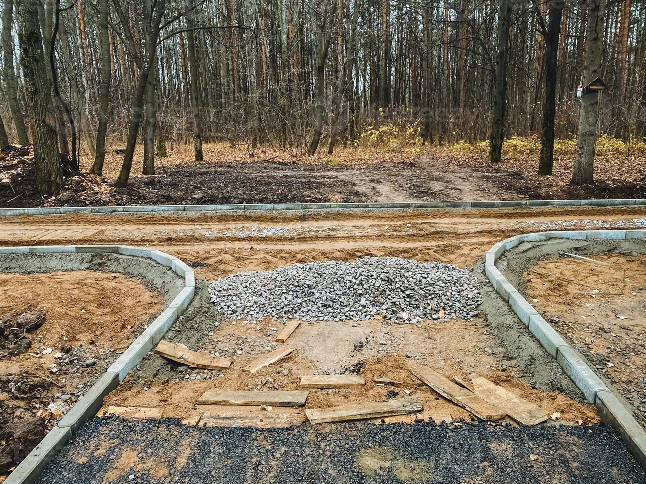 A new road is being built in a lush forest, causing significant disruptions to the local environment and severely impacting the surrounding ecosystem and wildlife populations photo