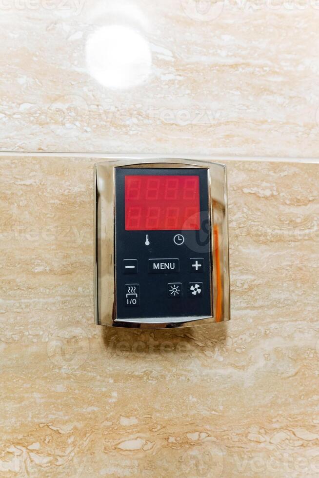 Introducing a sophisticated and contemporary digital control panel specifically designed for bathing systems found in luxurious and upscale bathrooms photo
