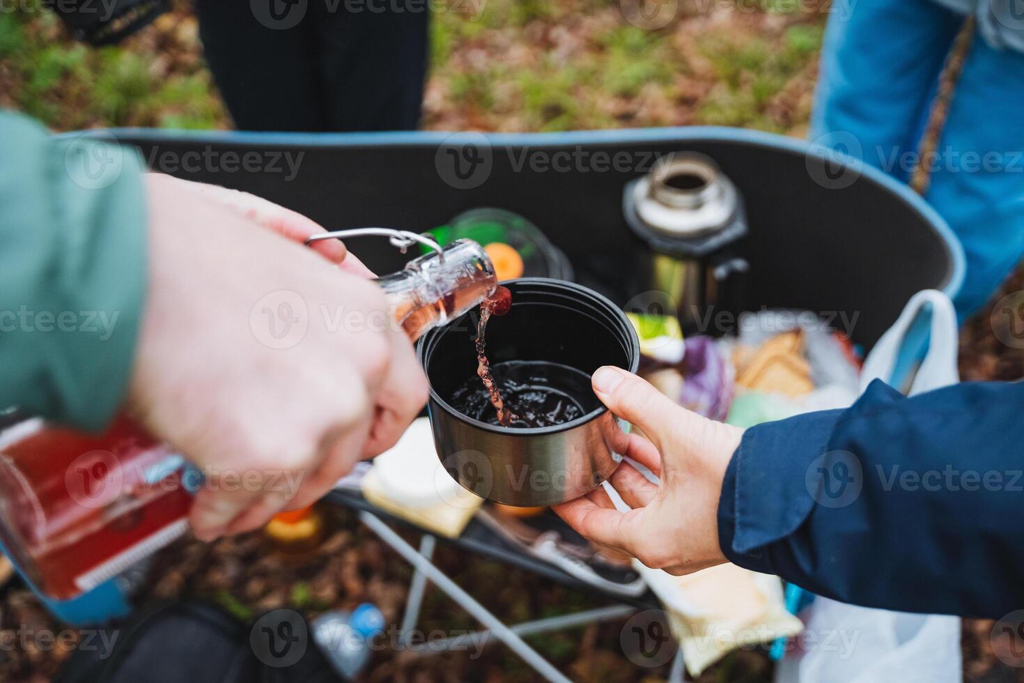 Sipping on warm drinks while surrounded by the beauty of nature helps create and share wonderful moments with dear friends during outdoor gatherings photo