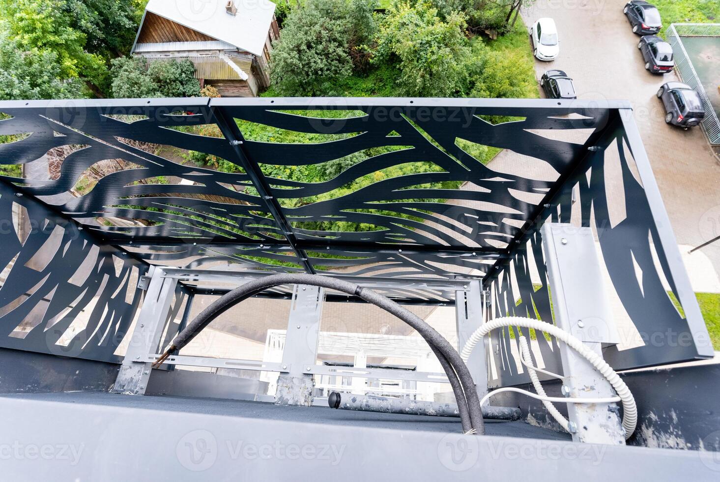 From a high vantage point of a tall building, one can see a scenic view that includes a balcony, adding to the urban landscape and architectural beauty of the city below photo