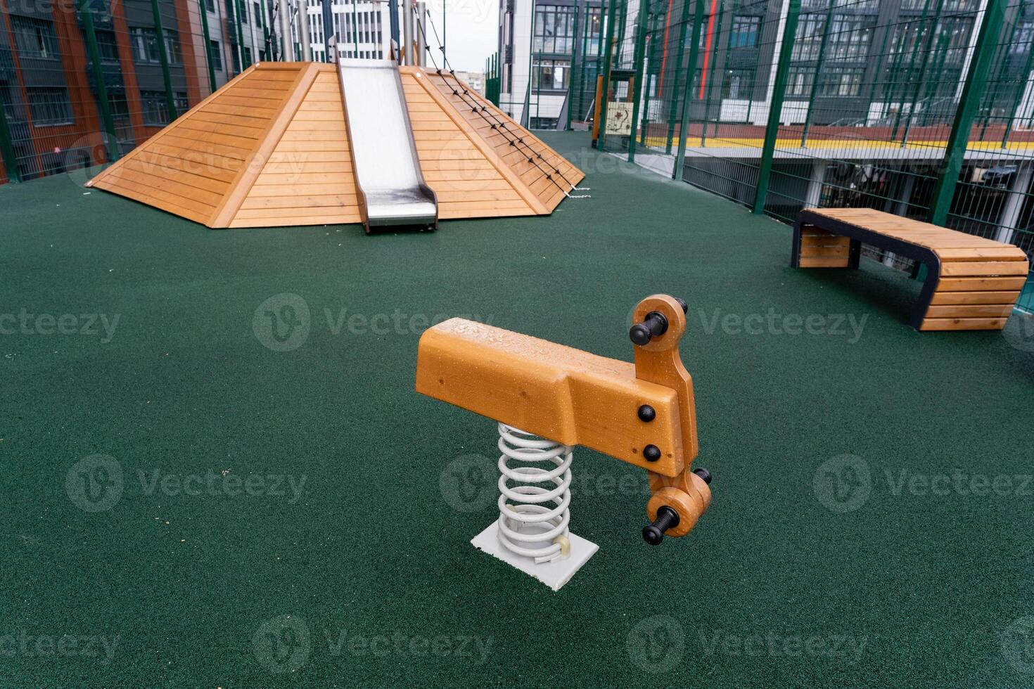 In a lively playground filled with laughter, a charming wooden rocking horse captivates children as they enjoy fun activities, creating lasting and cherished memories together photo