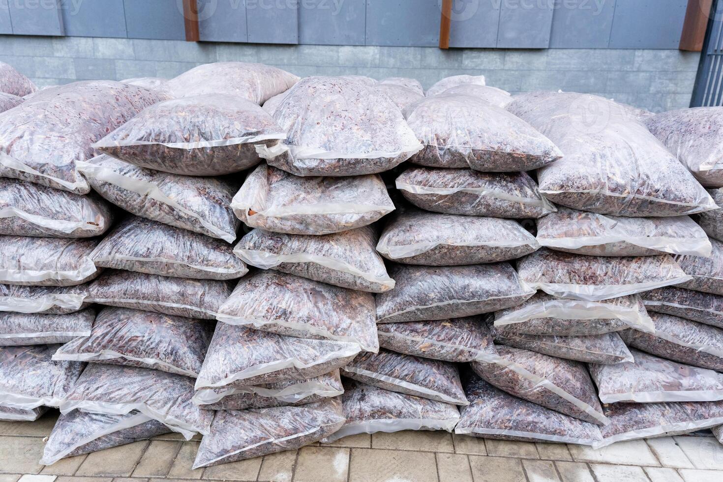 The Stacked Bags of Raw Materials Designed Specifically for Various Industrial and Commercial Uses Across Multiple Sectors Including Manufacturing photo