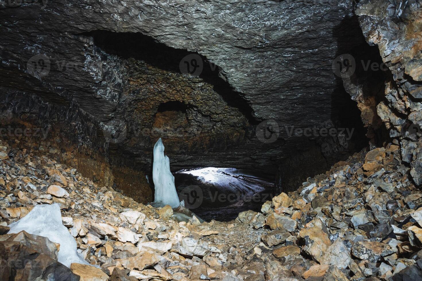 Deep within the caves mysterious depths, there exists a breathtaking and mesmerizing ice formation at its very center, showcasing an incredible and stunning display of natural beauty photo