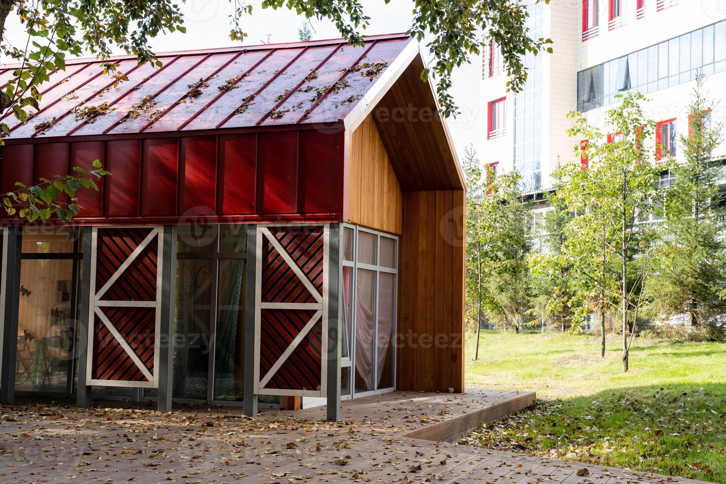 Discover a contemporary, ecofriendly shelter showcasing a unique and innovative design, perfectly nestled within a stunning urban garden environment photo
