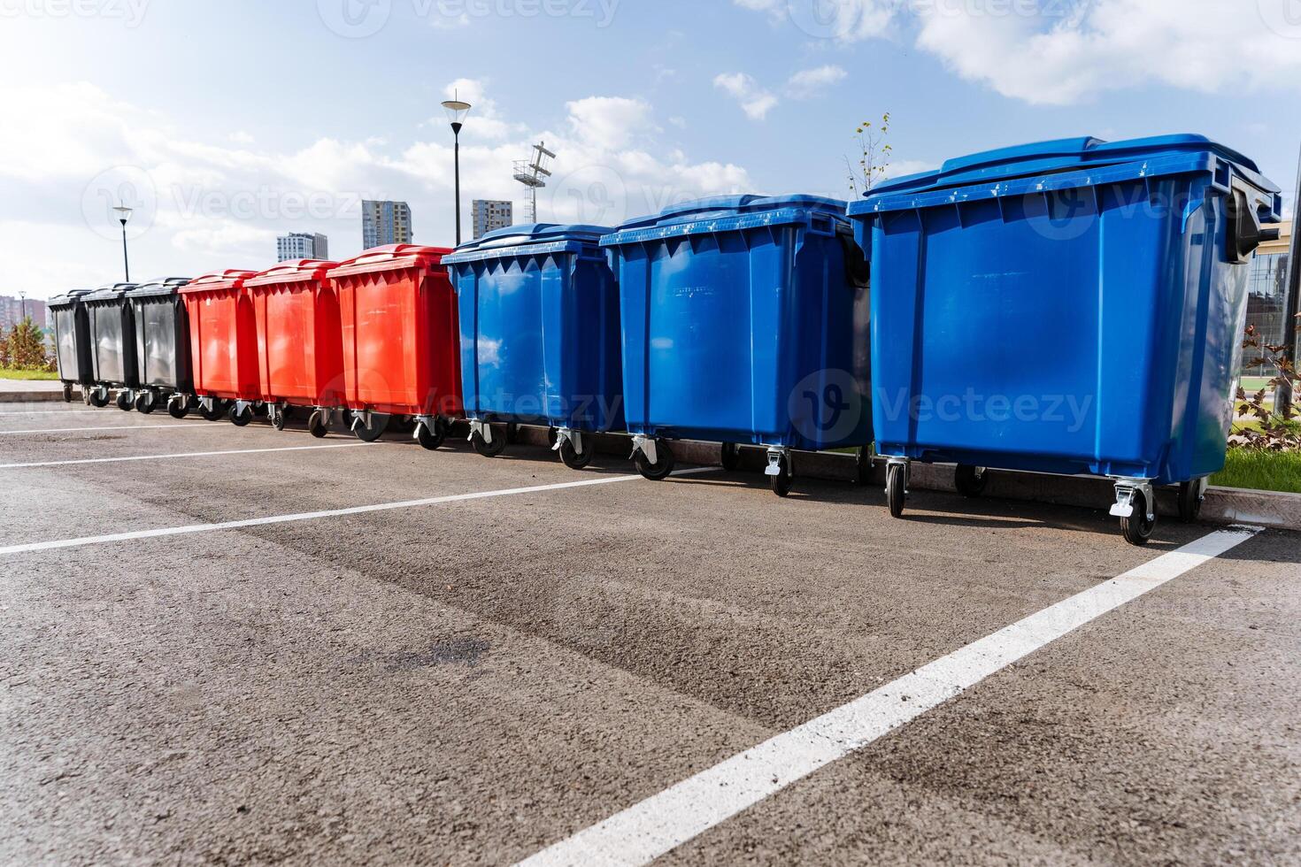 A vibrant and colorful row of recycling bins designed specifically for effective waste management and promoting environmental cleanliness photo