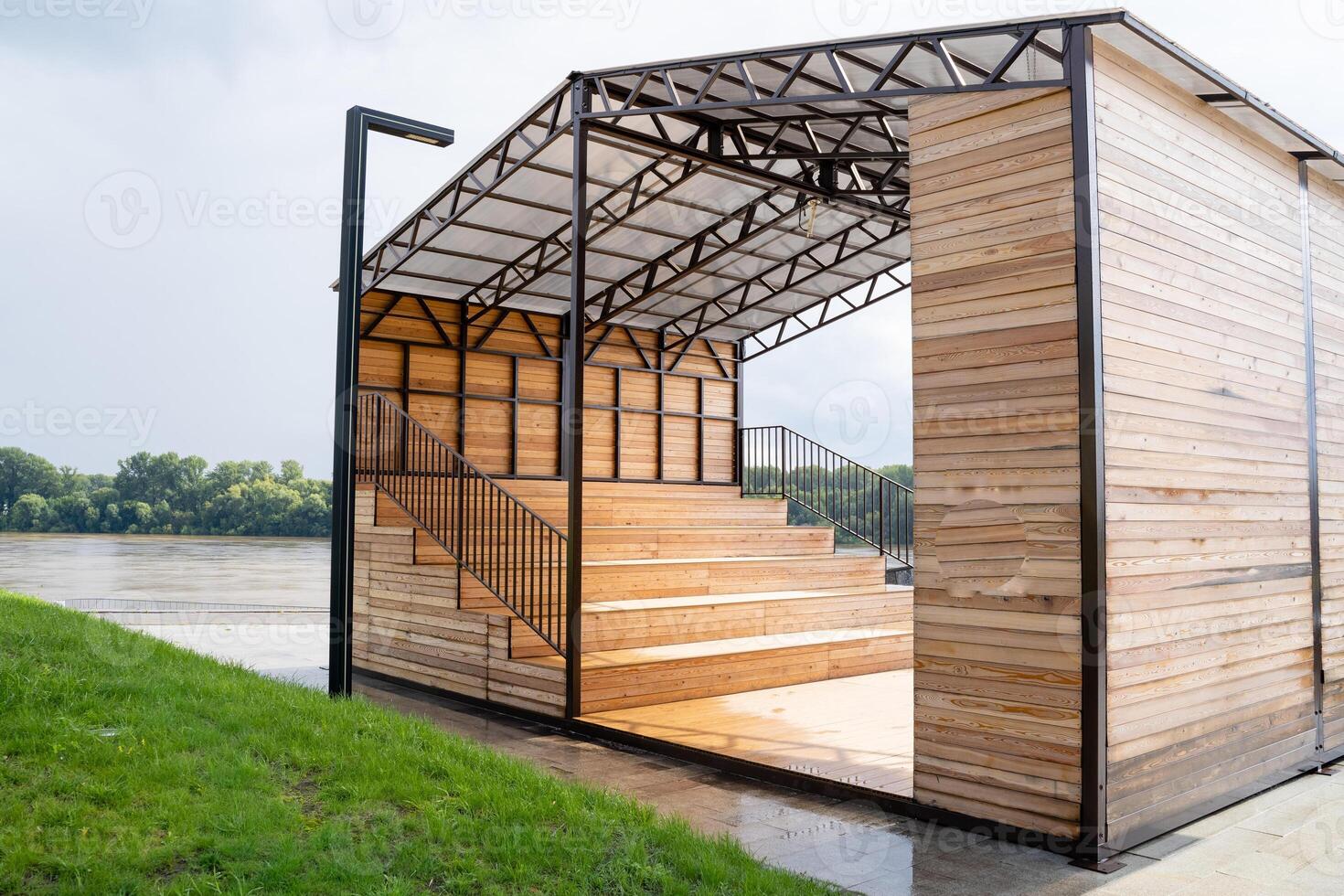 A Contemporary Wooden Structure Next to Water Unique Architectural Design That Harmonizes with Nature photo