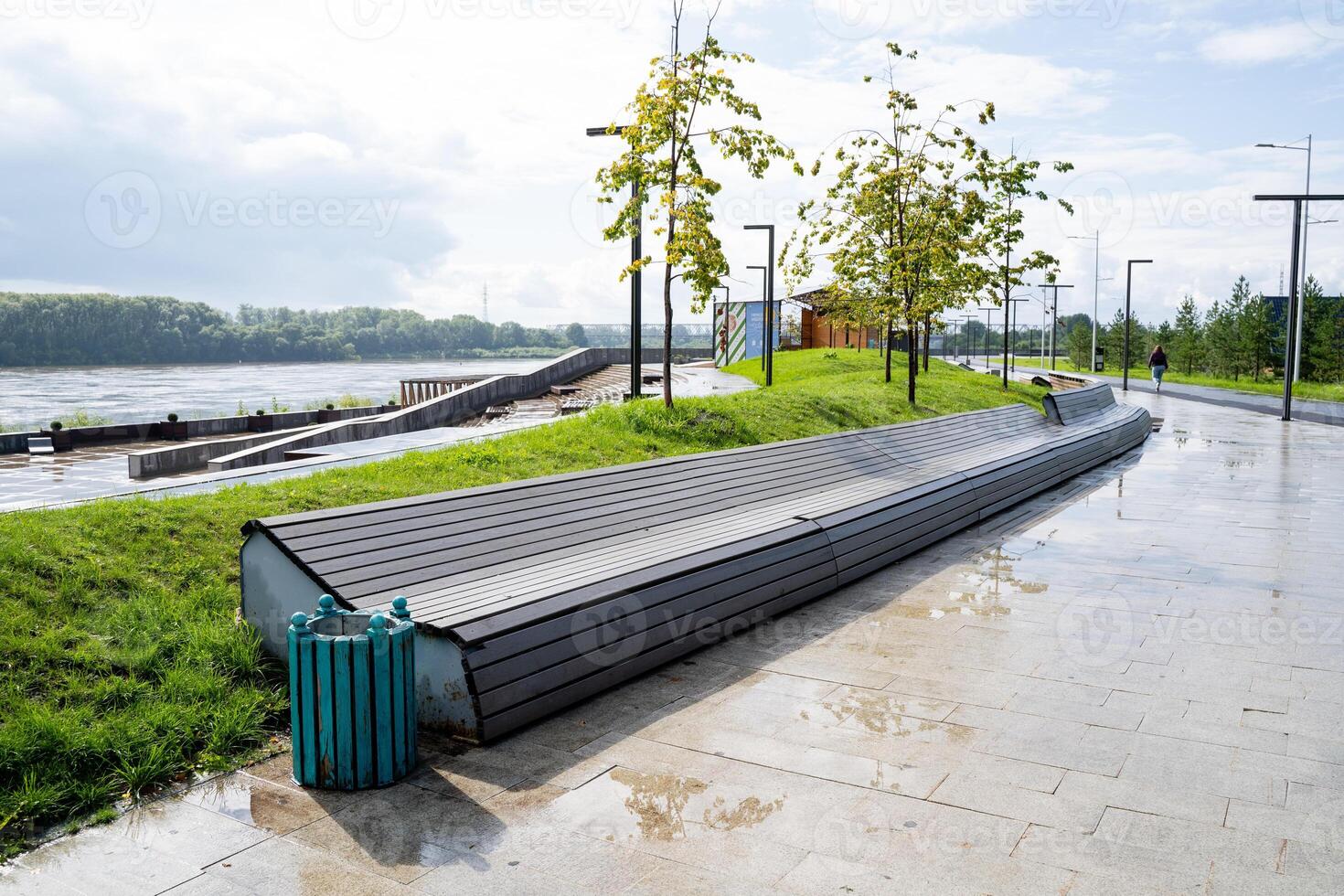 A Modern Coastal Bench Located Along a Beautiful and Scenic Pathway by the Riverside, Surrounded by Nature photo