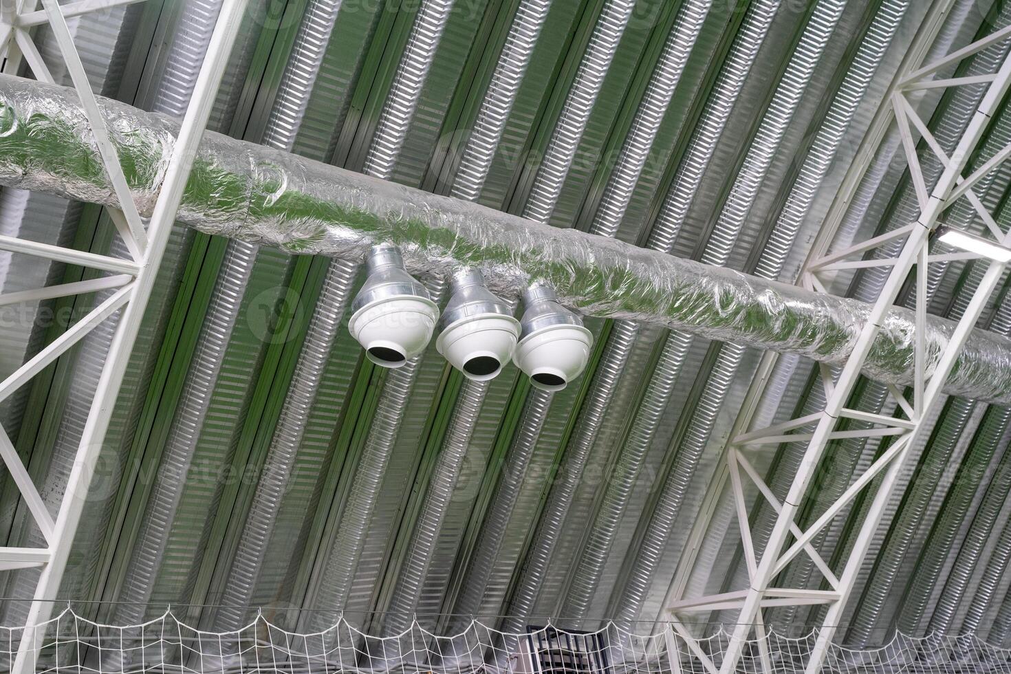 Three strategically positioned ceiling cameras throughout the entire building capture various perspectives and meticulously monitor the intricate details of that specific area effectively photo