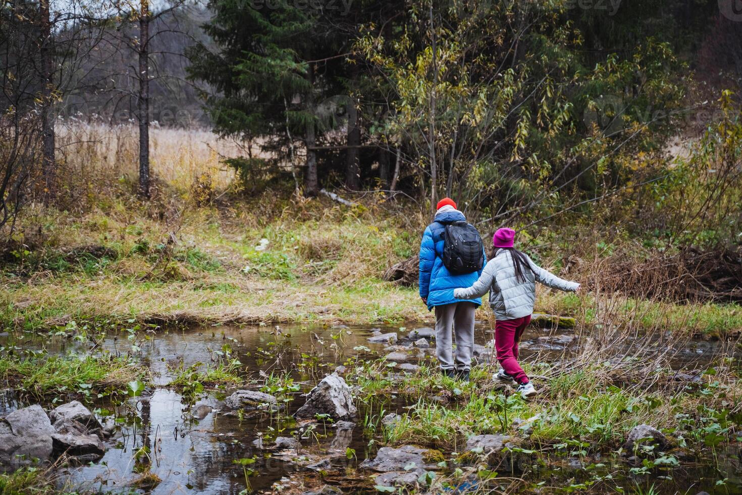 Children Exploring Nature A Beautiful Outdoor Adventure Awaits as Kids Enjoy Hiking Through the Scenic Wilderness and Discovering Wildlife photo