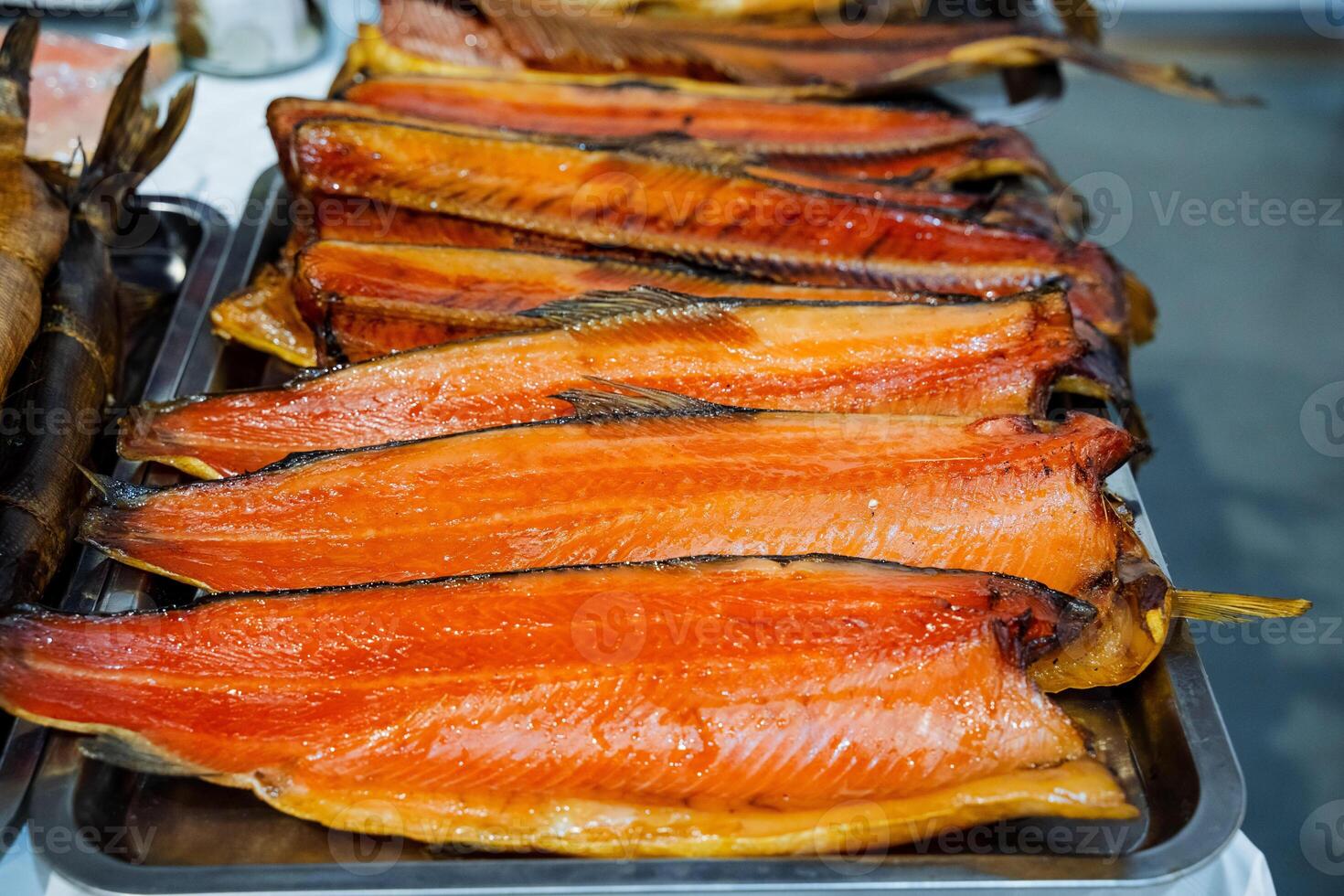A beautifully arranged tray of highquality, smoked salmon delights guests, making it a perfect appetizer and excellent meal choice for special occasions and festive gatherings photo