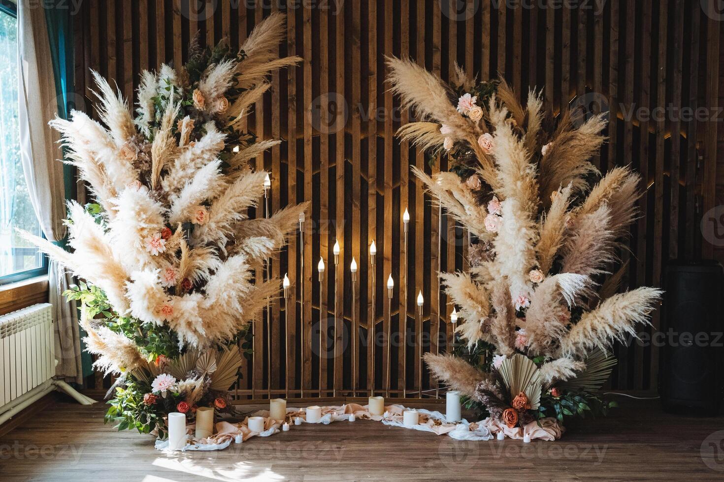 Discover the stunning and elegant Pampas Grass Decor that will enhance your Wedding Ceremony, beautifully complemented with floral accents photo