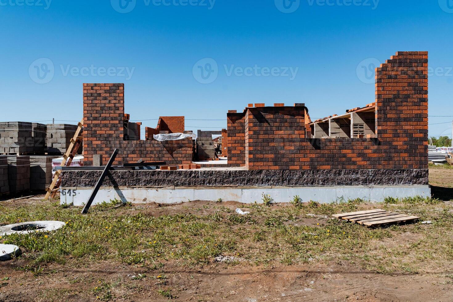 The construction of a new residential building is ongoing, with a brick shell being used for the exterior walls. This project highlights promising growth in the housing sector photo