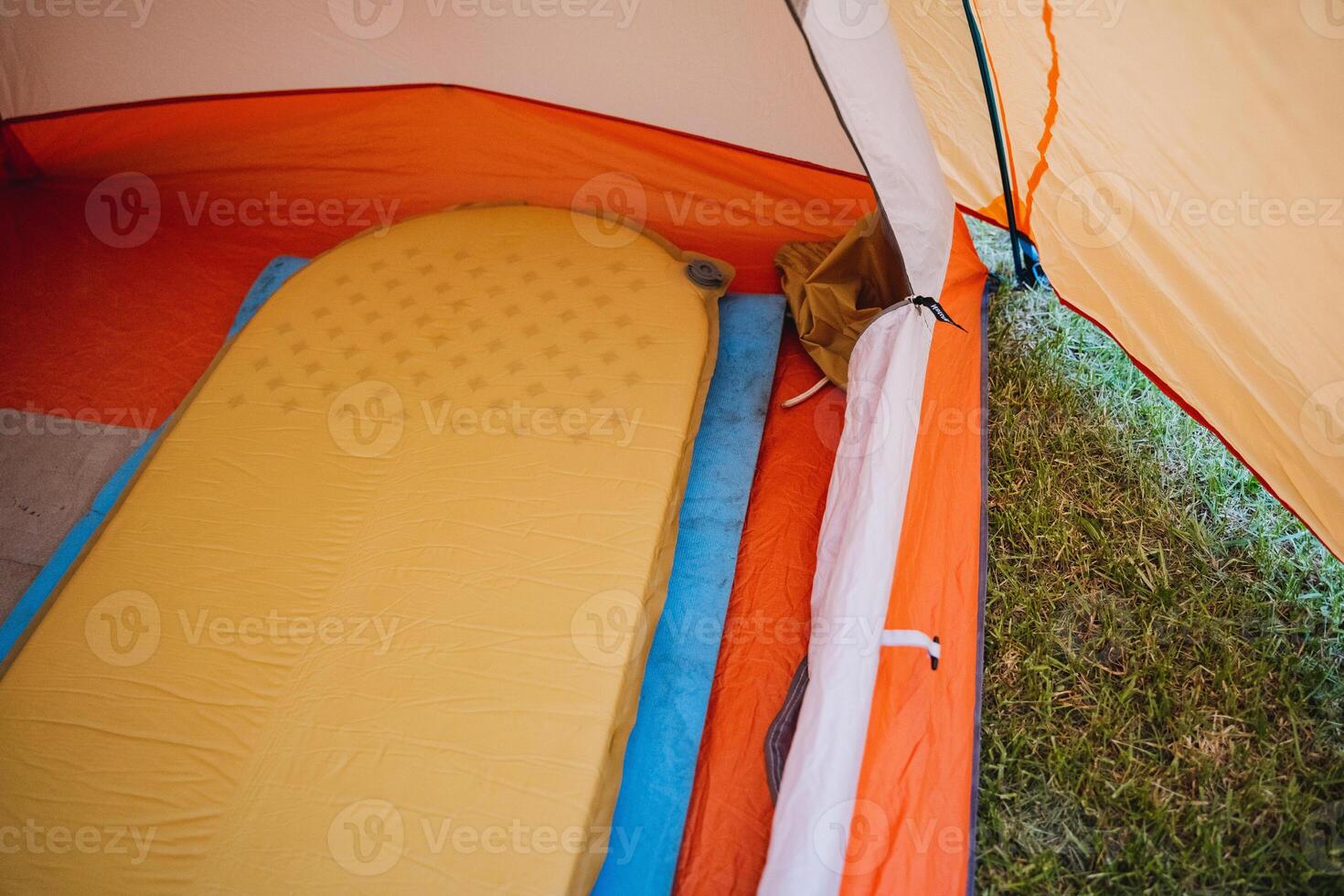 Ideal camping setup includes a cozy tent interior view with a comfortable sleeping pad. Enjoy outdoor adventures and relaxing moments with the right camping gear photo