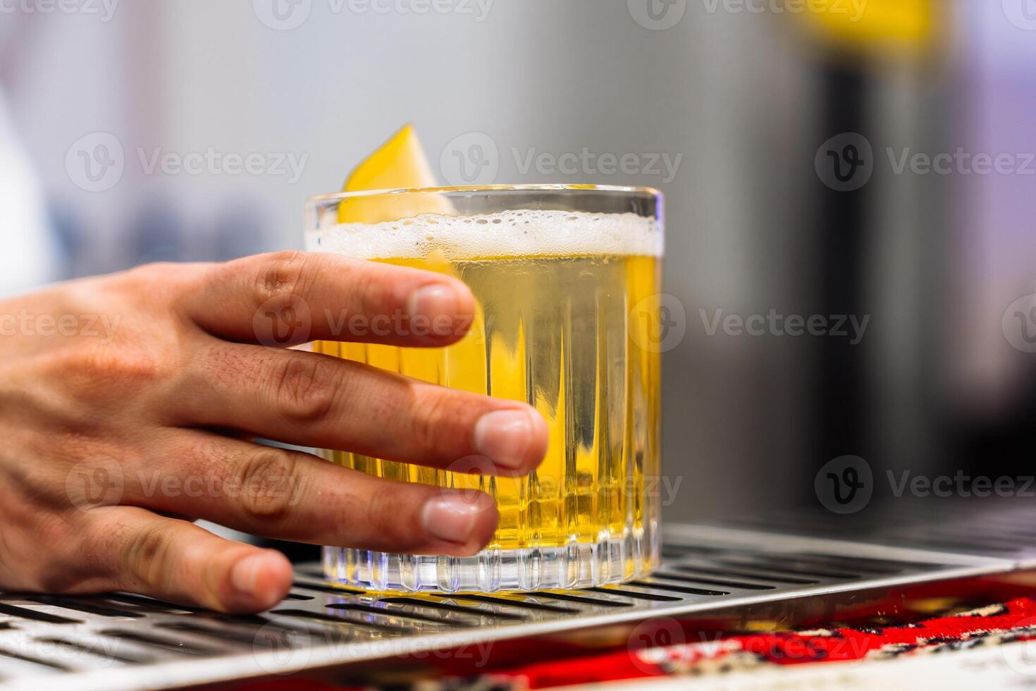 Enjoying a refreshing cocktail at a lively bar on a sunny afternoon photo