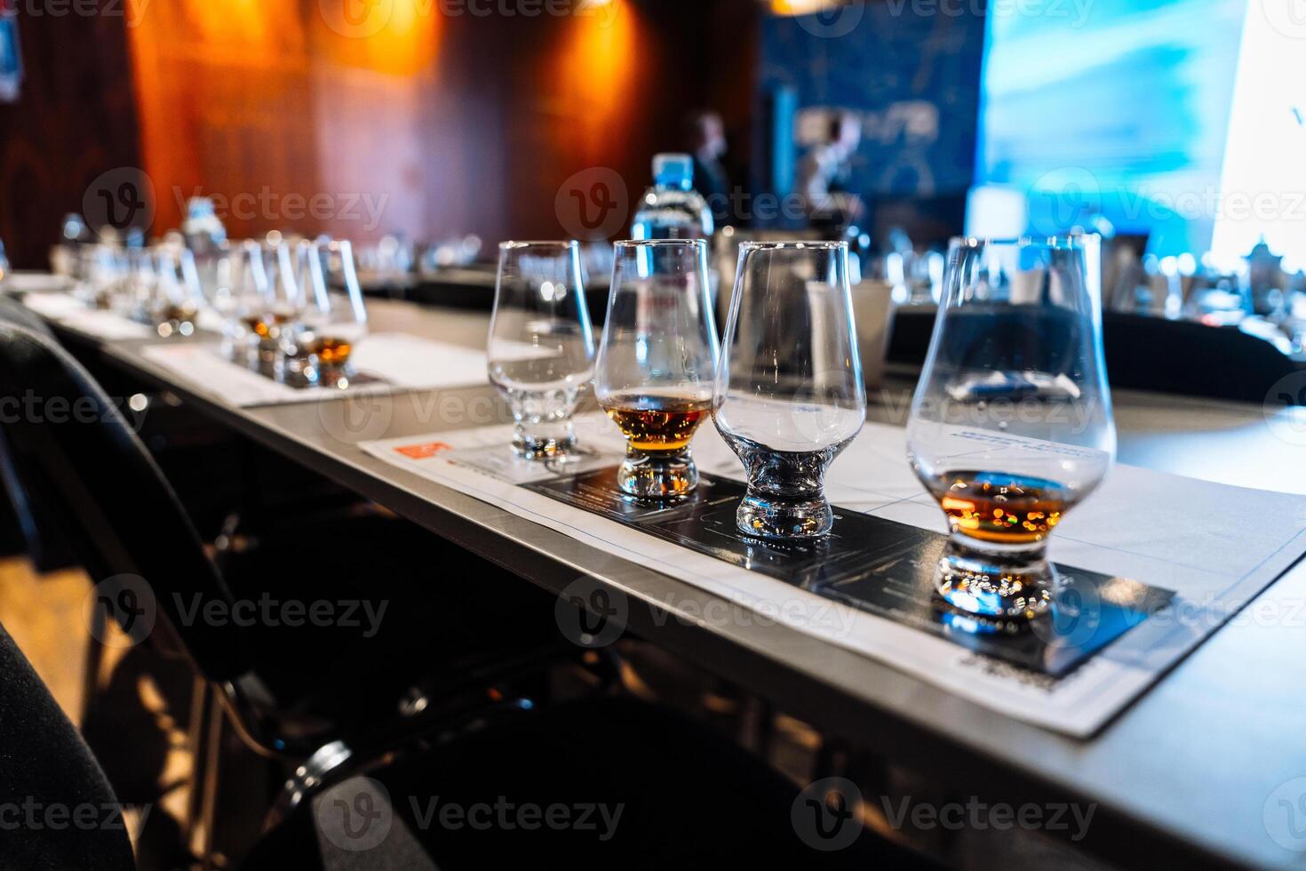 Engaging cocktail preparation and alcohol tasting event in a stylish venue photo