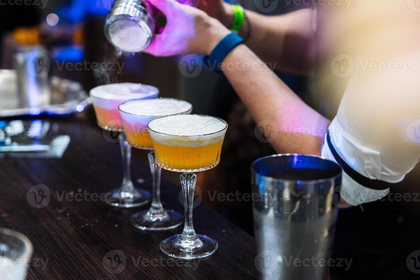 Enjoying a vibrant cocktail tasting evening at a stylish bar in the city photo