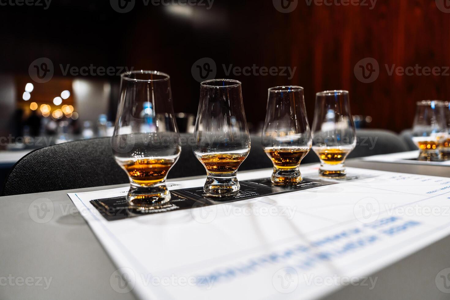 Enjoying a whiskey tasting session during a cocktail preparation event photo