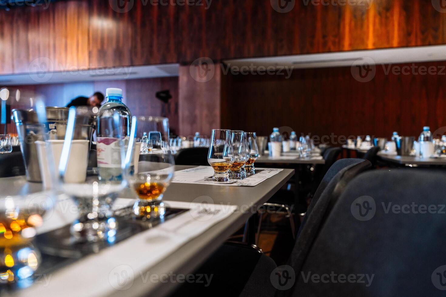 Group of tasting glasses set for cocktail preparation event at a venue photo