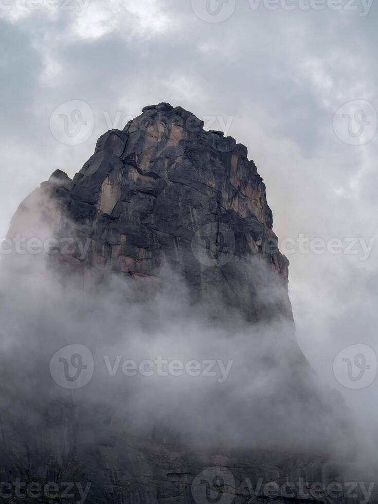 Dramatic deep dangers gorge with sharp sheer crags silhouettes photo