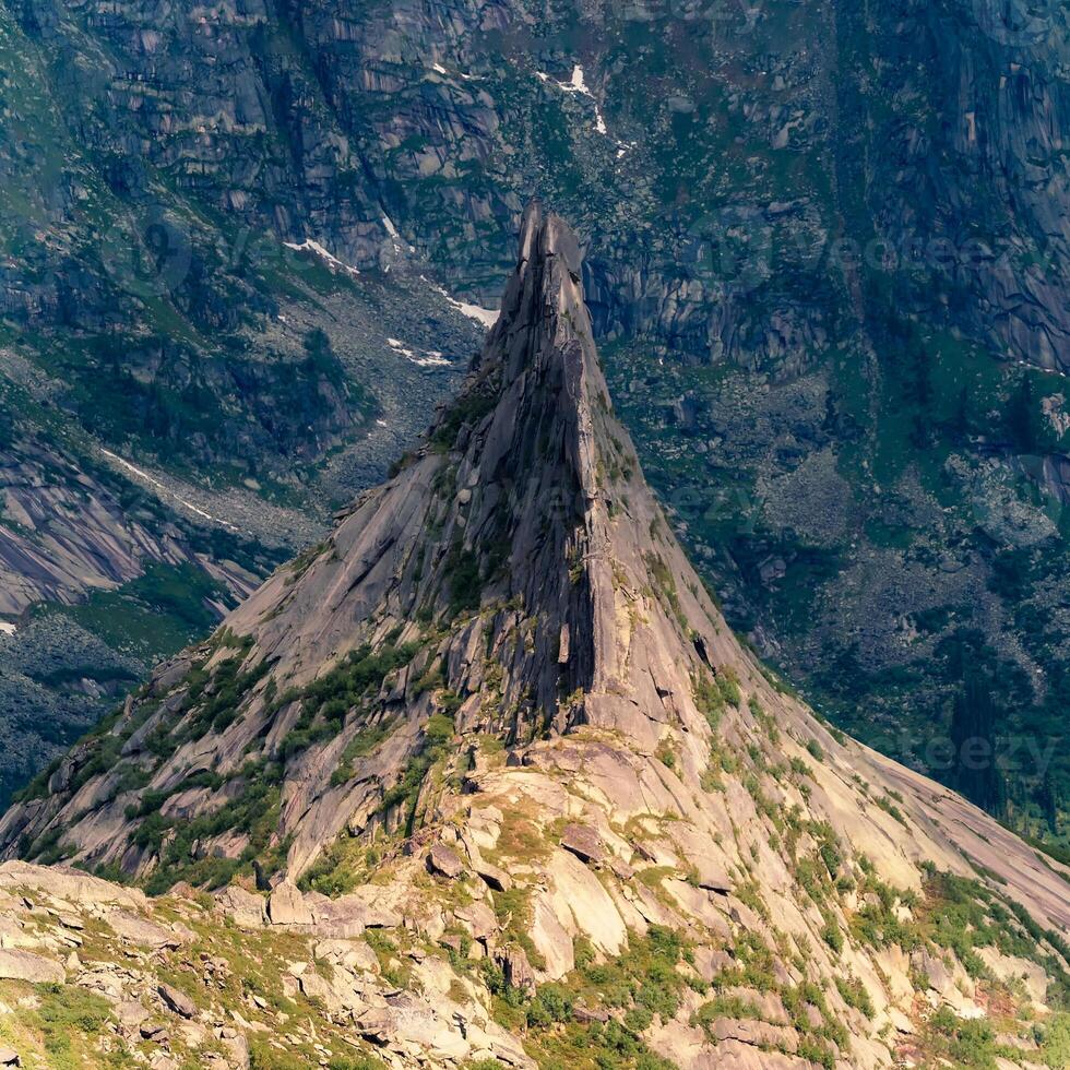 Pointed cliff, a misty mountainside. Ghost rocks. photo