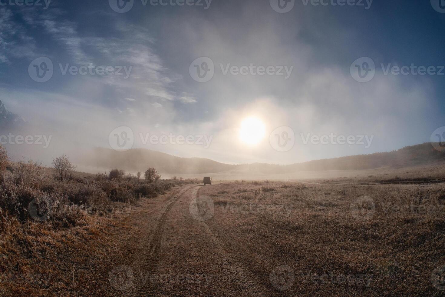 The road in the dry steppe in Altai region at dawn. photo