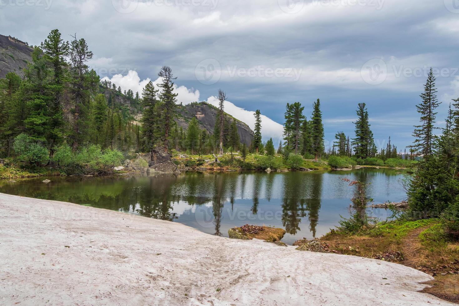 Clear Mountain lake in deep taiga. photo