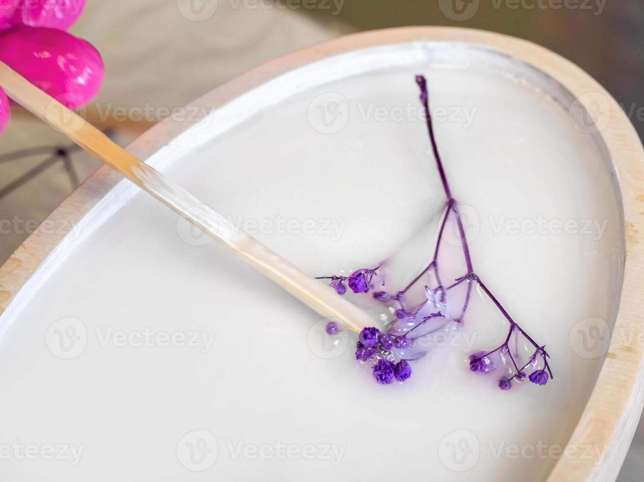 The art process of pouring epoxy resin into a wooden toy. Techno photo