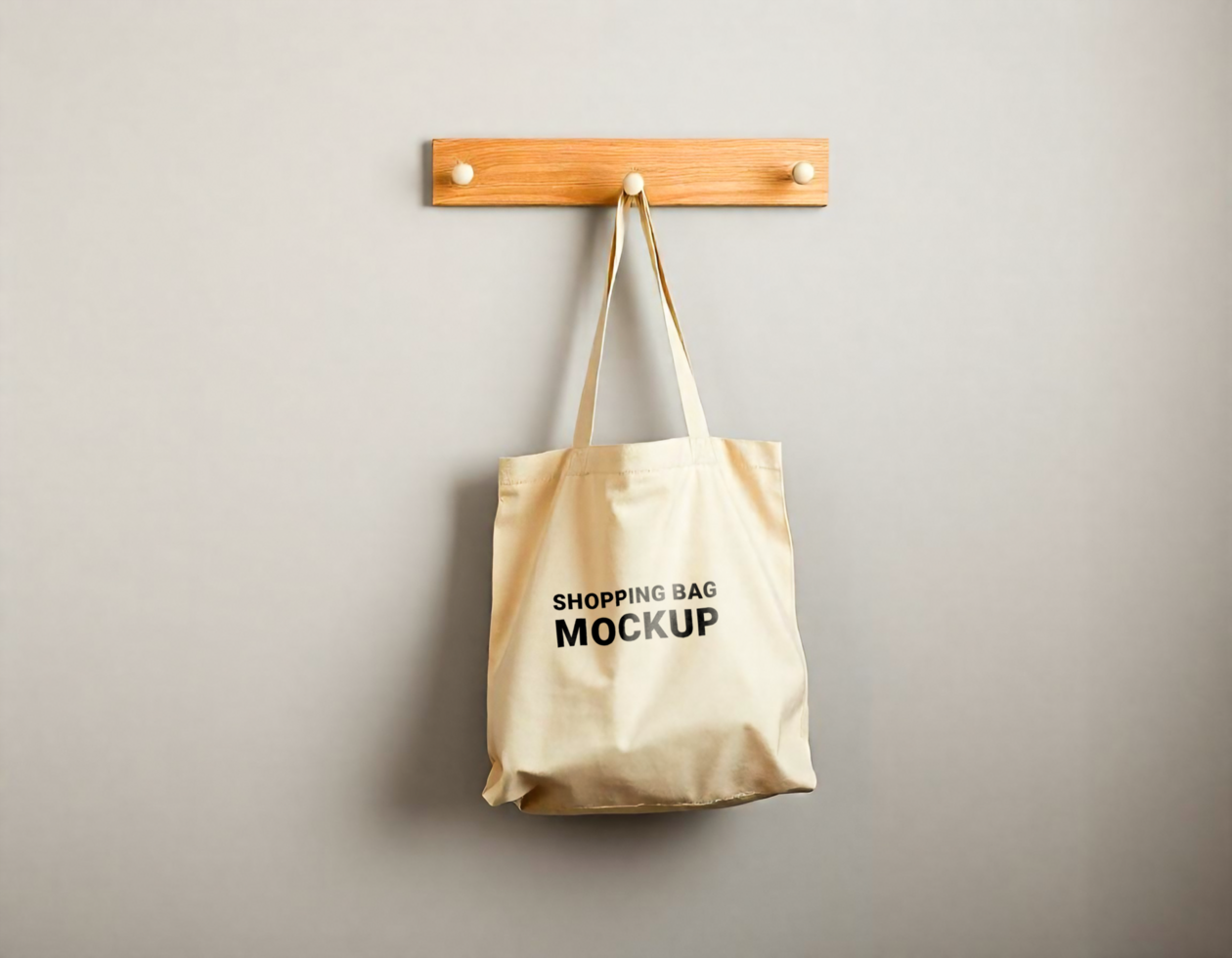 The tote bag dangles naturally, showcasing its design for a mockup psd