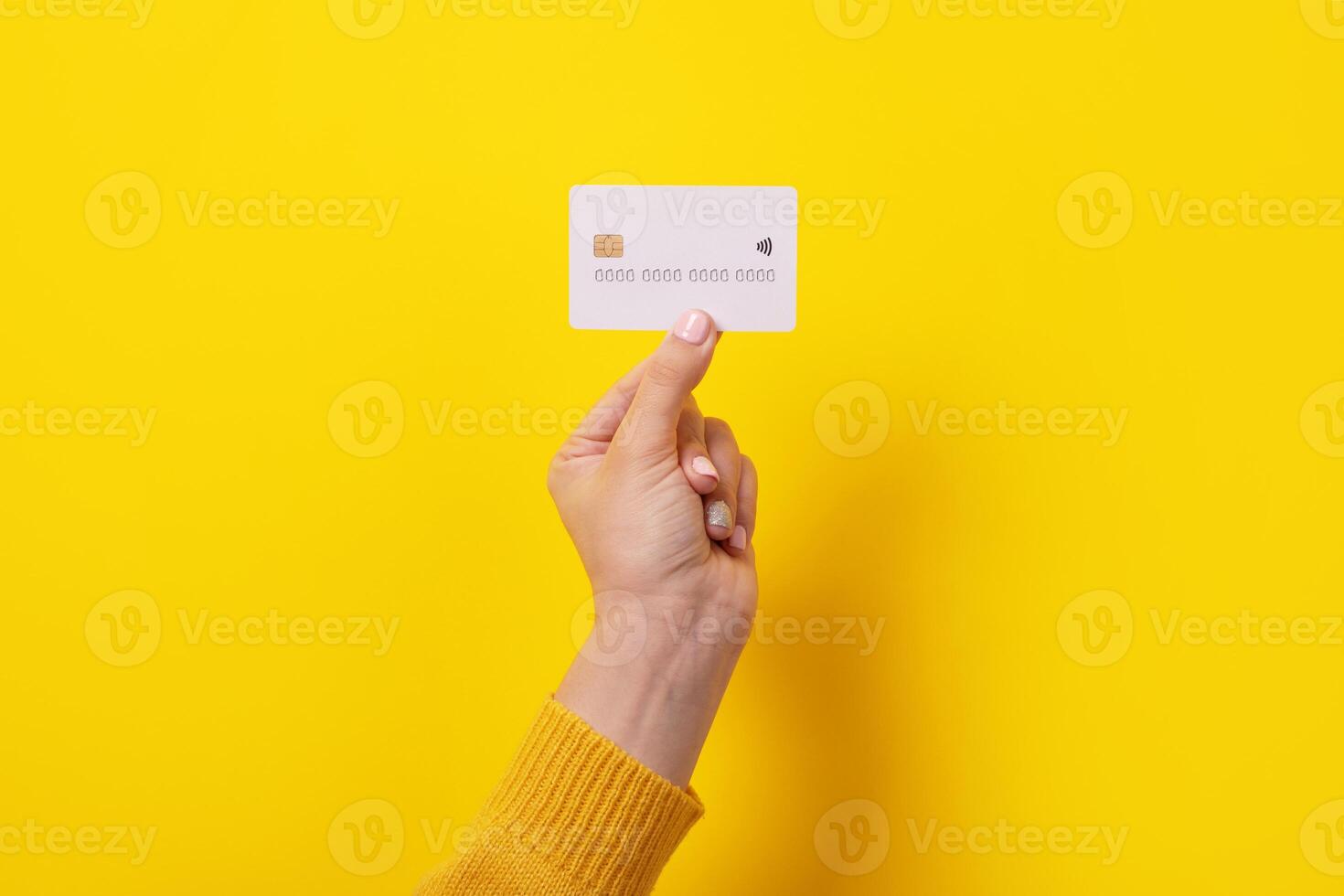 credit card in female hand photo