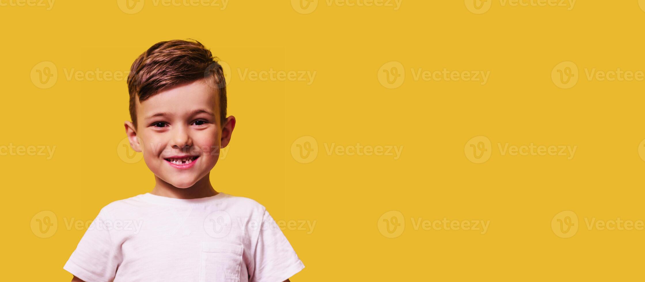 Cute boy without front teeth laughs. Changing teeth and hygiene. Close-up. copy space photo