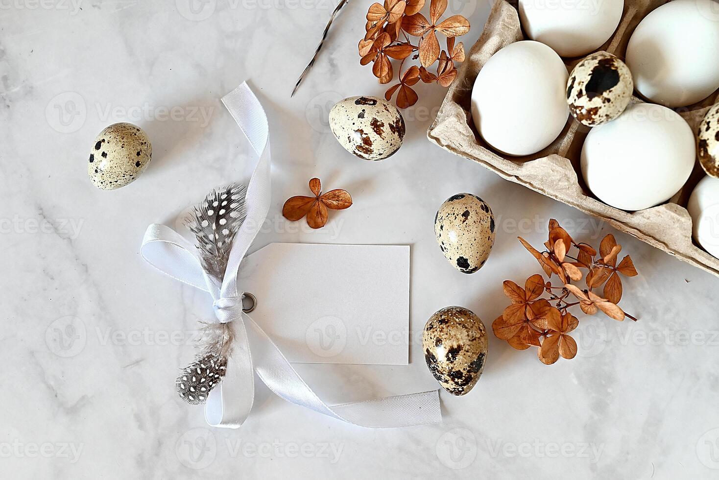 A beautiful and delicate arrangement of natural elements on a white marble surface. photo