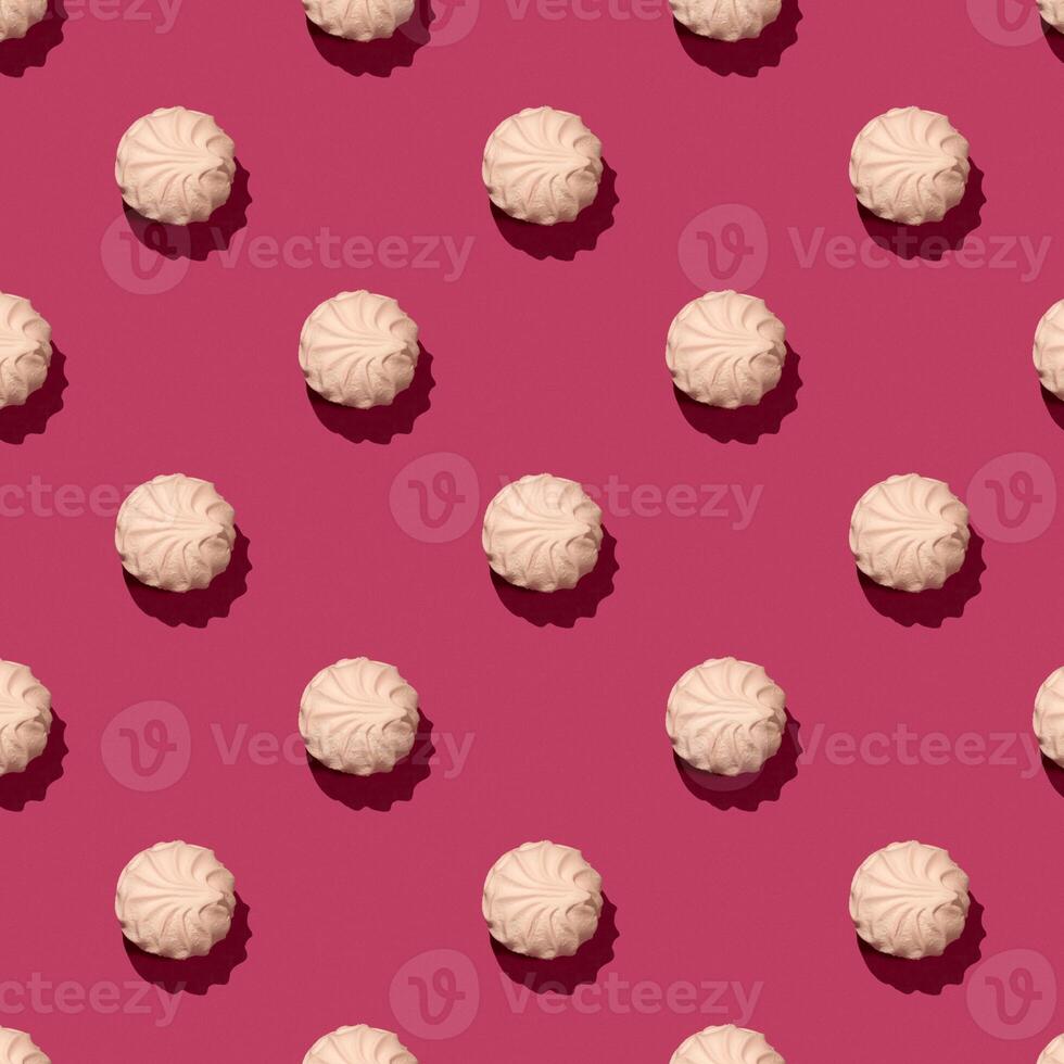 Soft pink marshmallow on pinky background, zephyr on a pink background. Seamless Zephyr Pattern, hard shadow photo