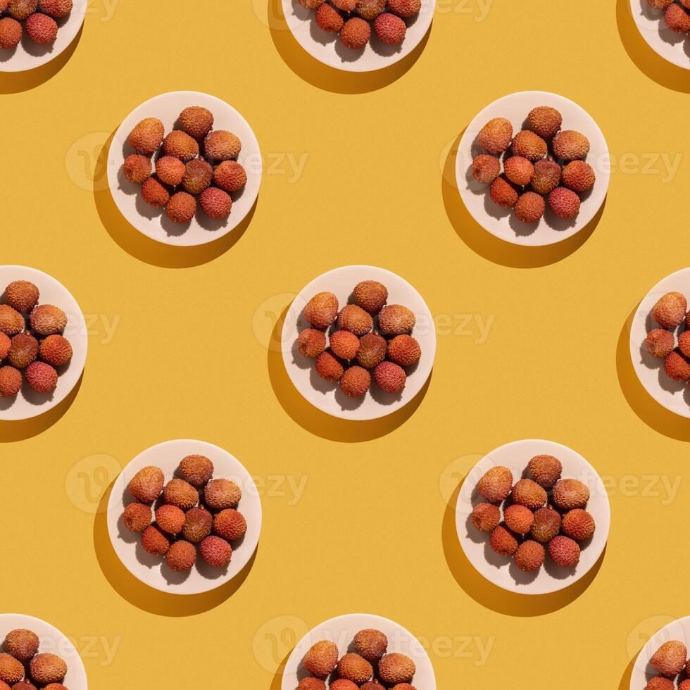 Plate of lychee fruit on yellow background, lychee pattern, Seamless lychee pattern photo