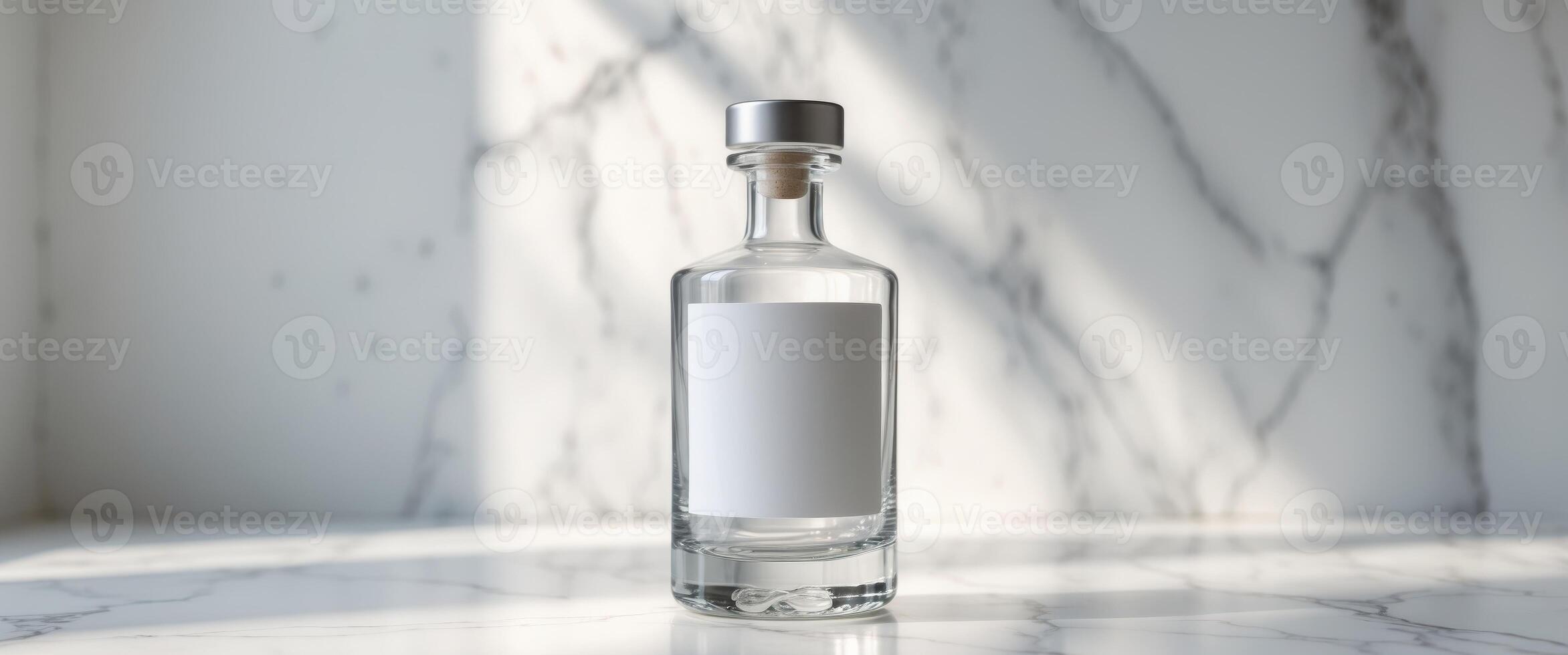 Elegant liquor bottle with blank label resting on marble surfaceElegant liquor bottle with blank label resting on marble surface. photo