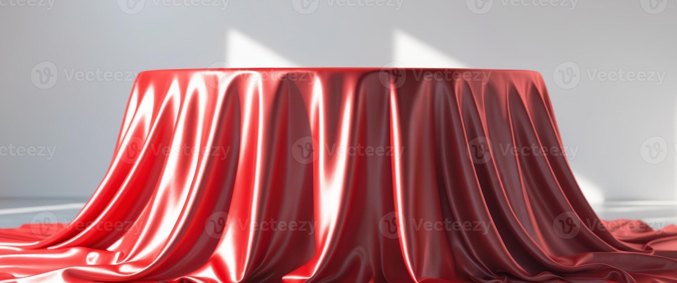 A red tablecloth draped over a round table photo