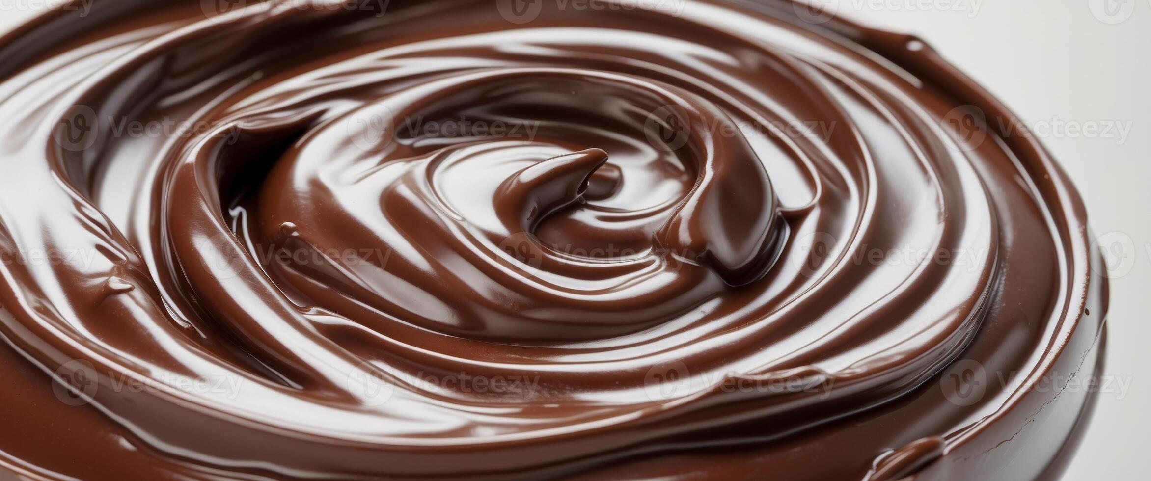 Rich dark chocolate spread texture with smooth swirls photo