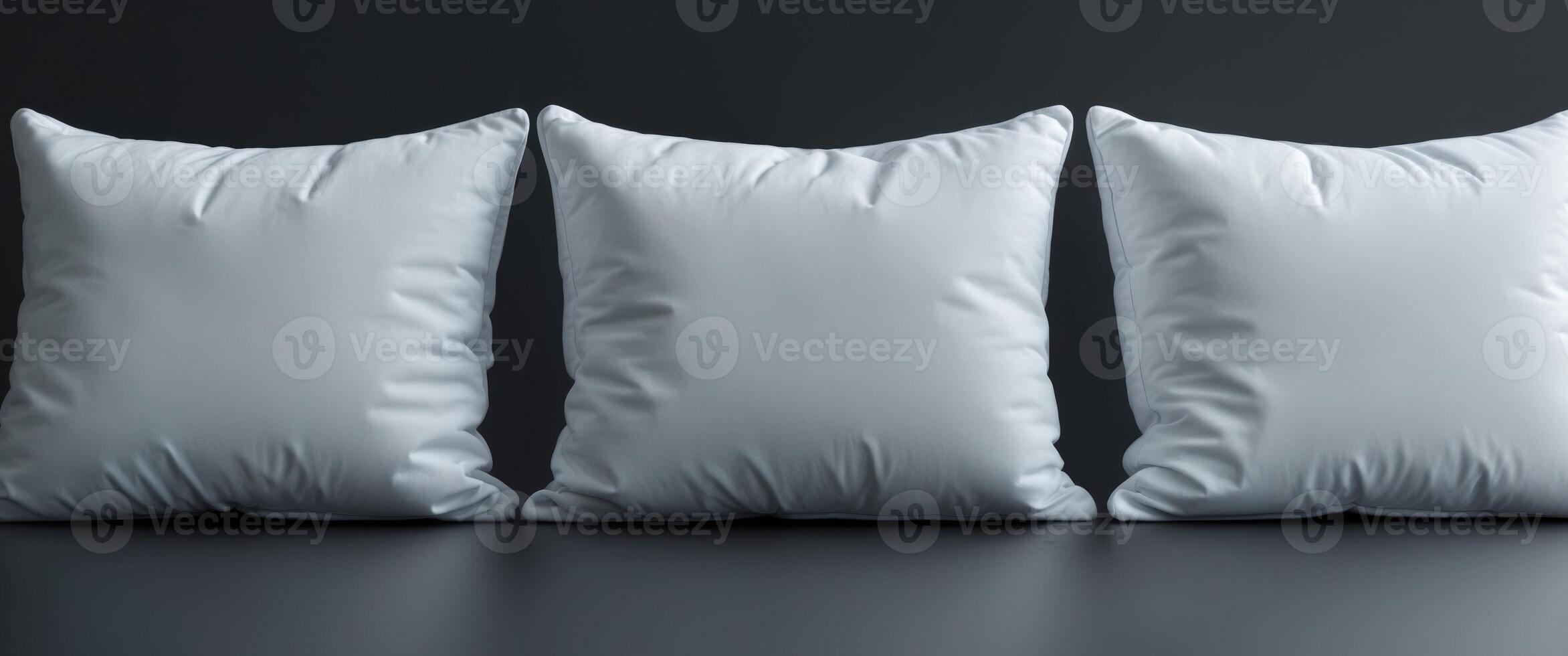 Three Empty White Cushions on Black Background for Creative Use photo