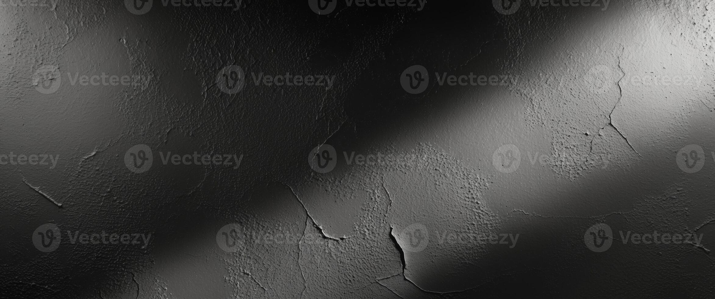 Black and white photo of a wall with a light shining on it