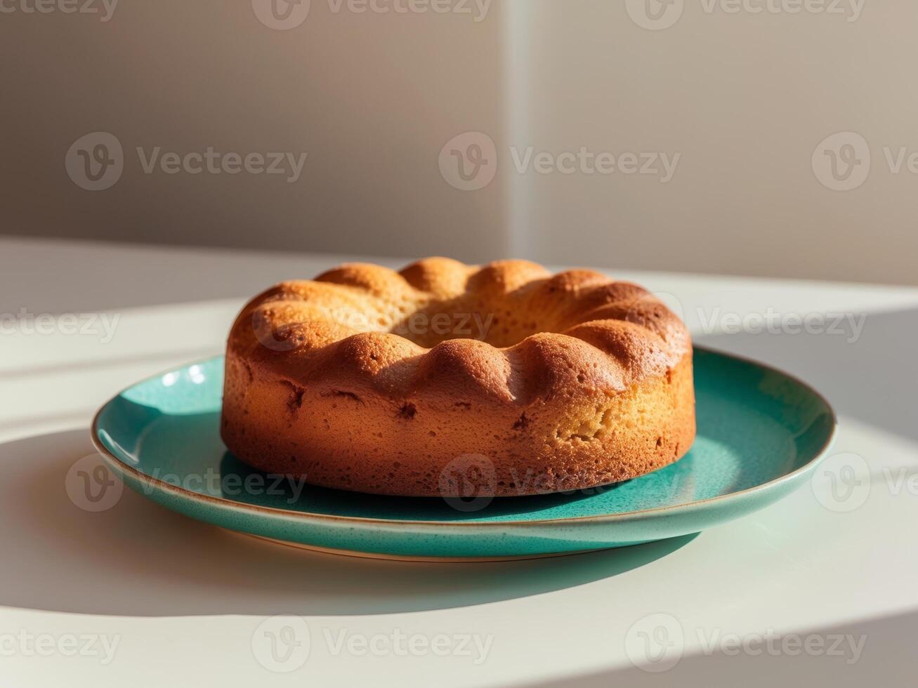Delicious Homemade Sponge Cake on Teal Plate photo
