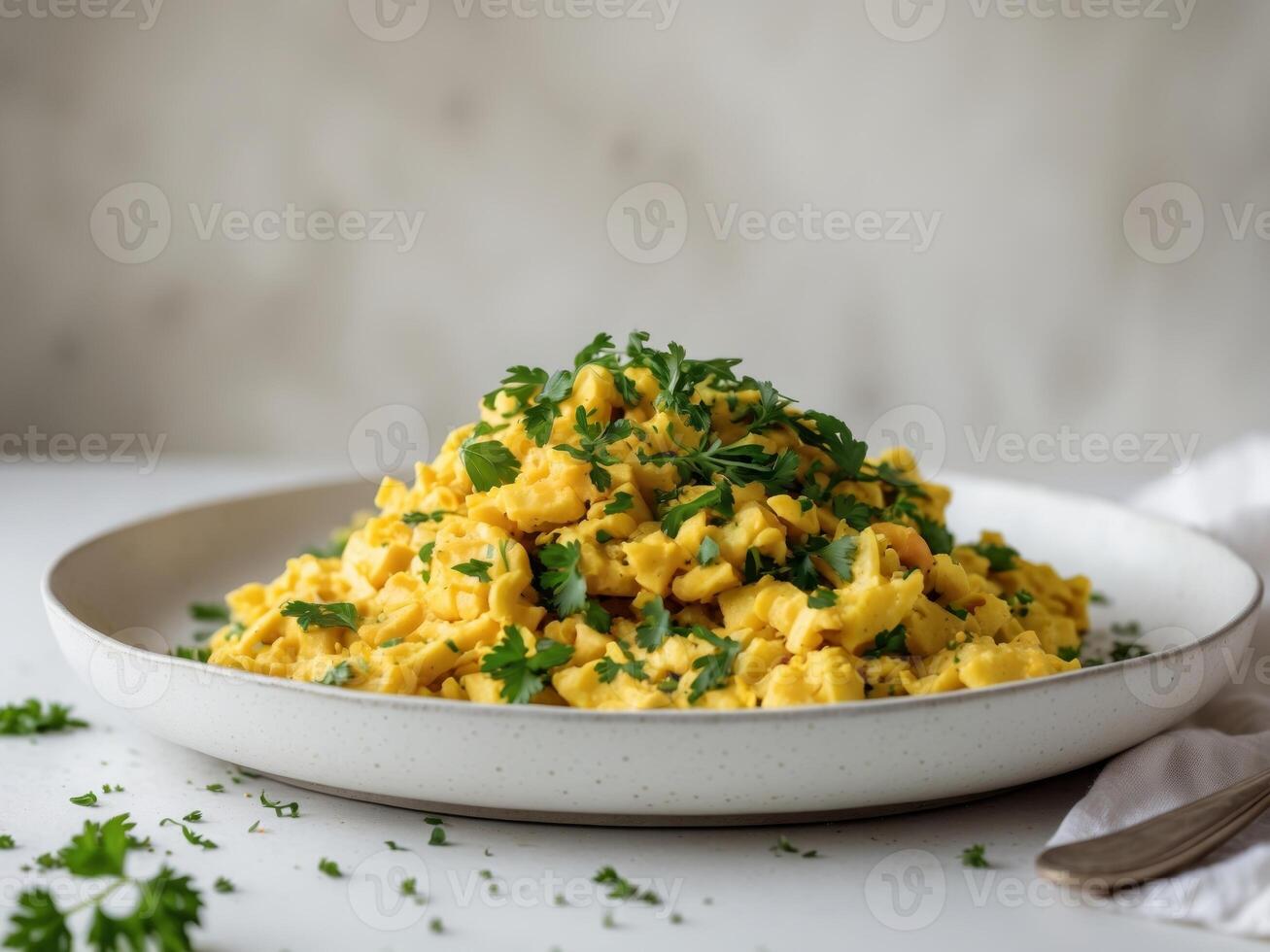 Vegan scramble flavored with chopped parsleyVegan scramble flavored with chopped parsley. photo
