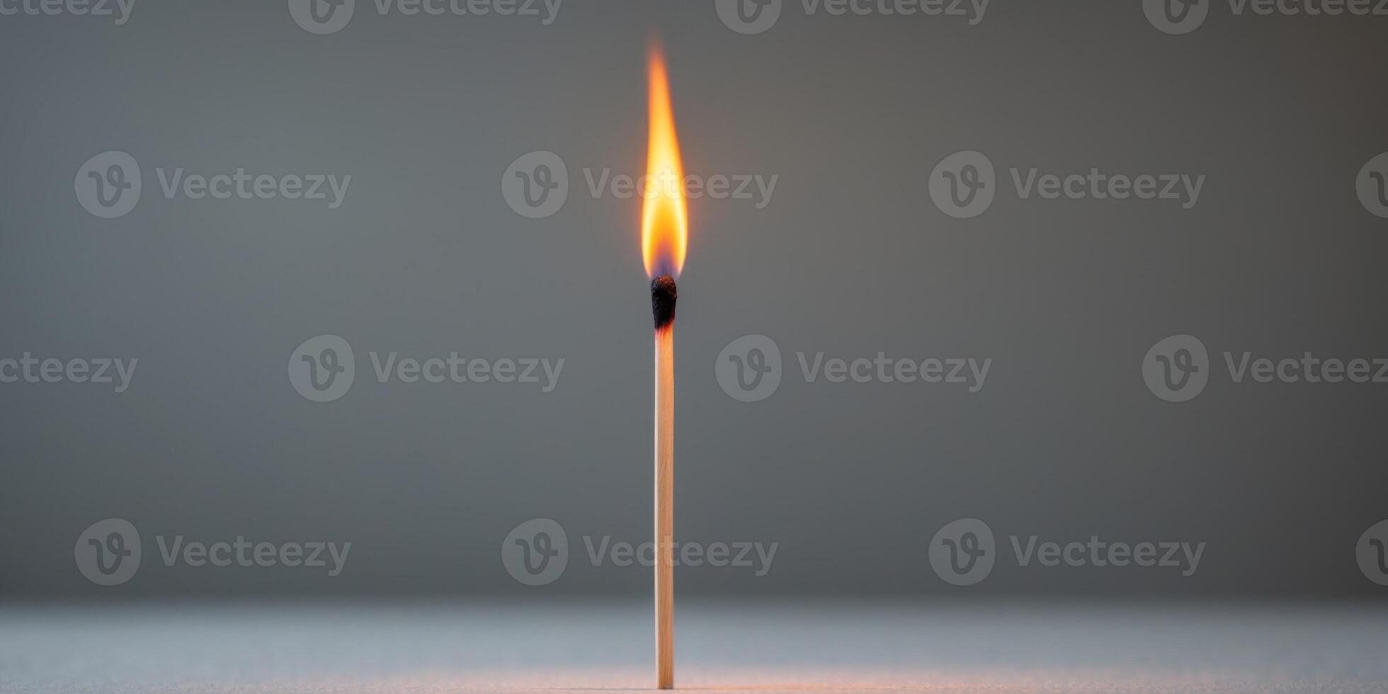 Matchstick is lit and the flame is yellowMatchstick is lit and the flame is yellow. photo