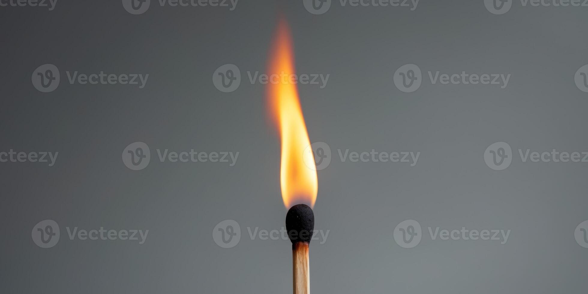 Matchstick is lit and the flame is yellow photo