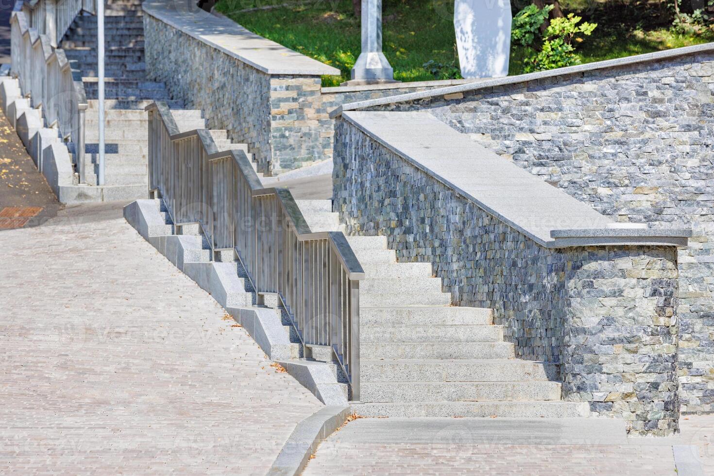 Stone staircase in modern architecture of urban landscape design. photo